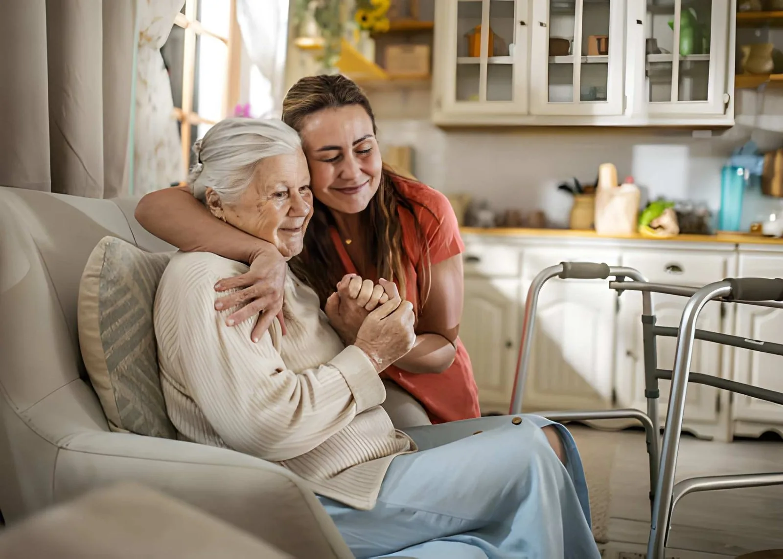 Caregiver comforting an older adult at home
